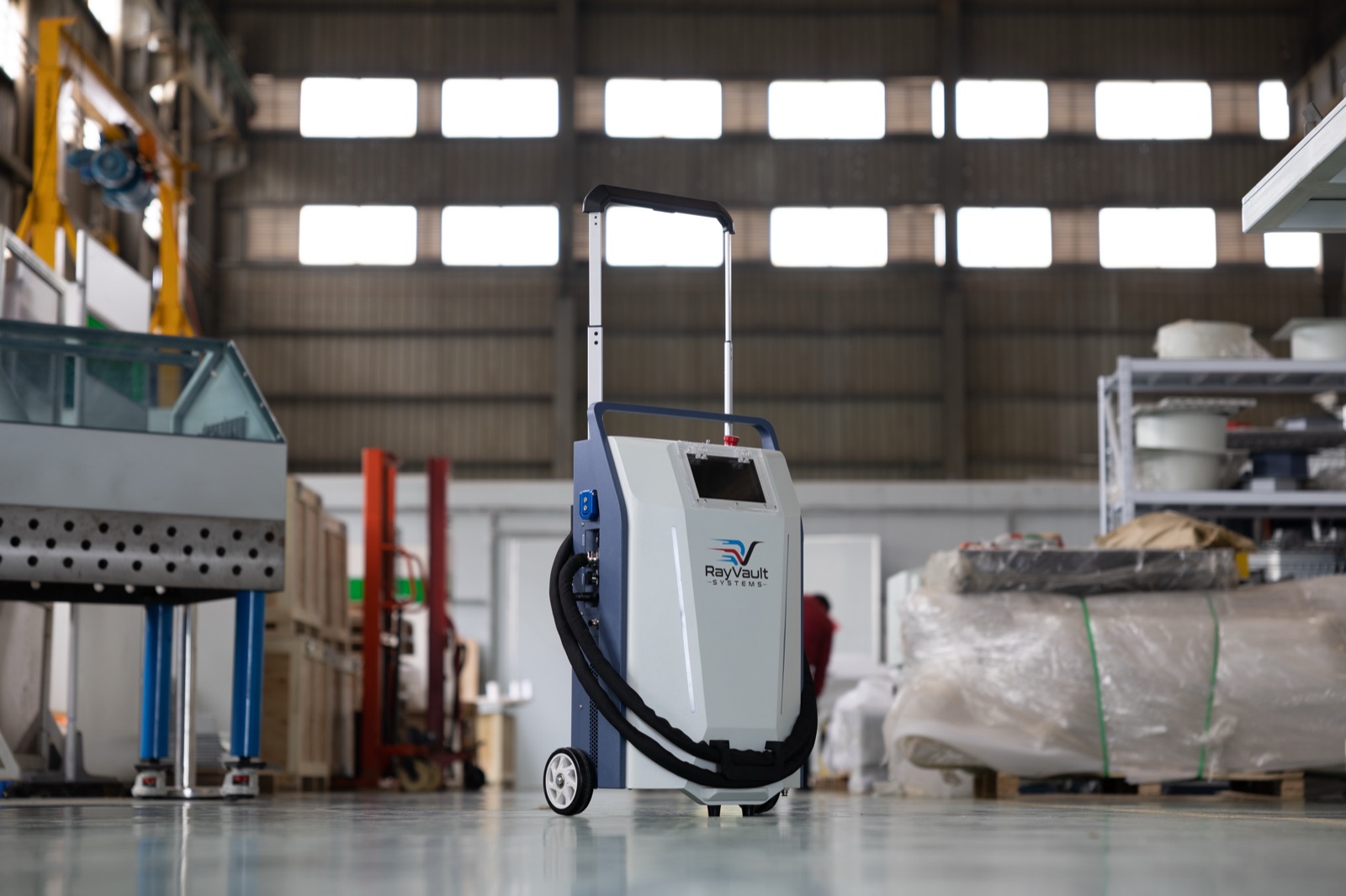 Telescoping trolley handle — rolls like a suitcase, loads in a pickup bed